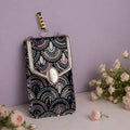 Black Embroidered Mobile Pouch Sling Bag with Oval Accent